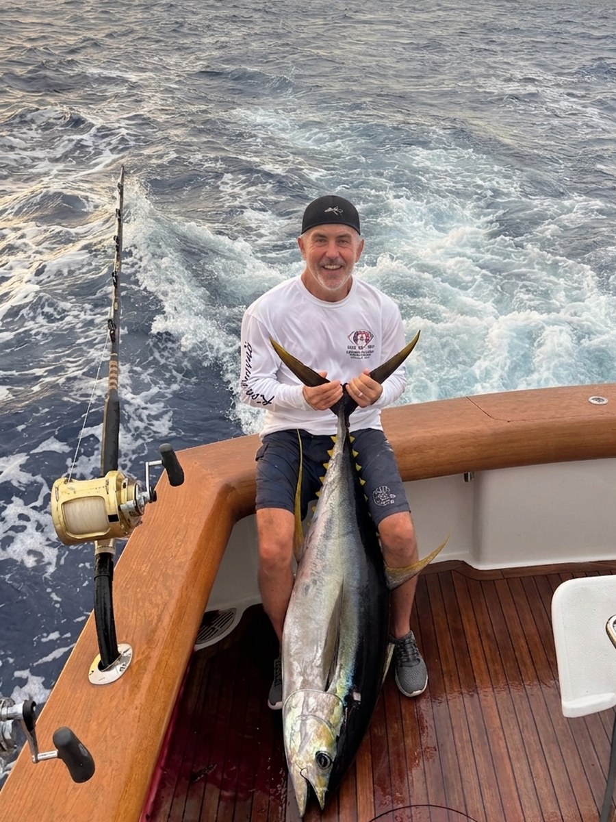 Captain Mark Bartell of Ambush Sportfishing with a Kona yellowfin tuna (ahi)